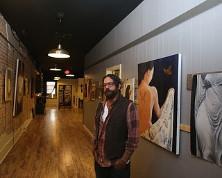 Aaron Chine stands in the gallery, Thursday, August 24, 2017 at The Box Gallery in Warren...(Nikos Frazier | The Vindicator)