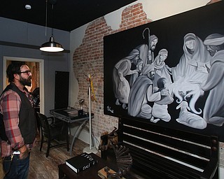 Aaron Chine stands in the gallery, Thursday, August 24, 2017 at The Box Gallery in Warren...(Nikos Frazier | The Vindicator)