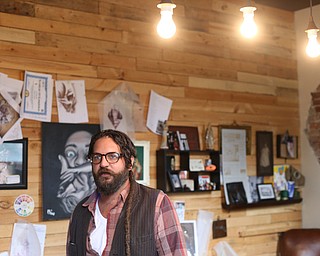 Aaron Chine stands in his studio space, Thursday, August 24, 2017 at The Box Gallery in Warren...(Nikos Frazier | The Vindicator)