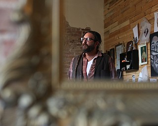 Reflection of Aaron Chine in his studio space, Thursday, August 24, 2017 at The Box Gallery in Warren...(Nikos Frazier | The Vindicator)