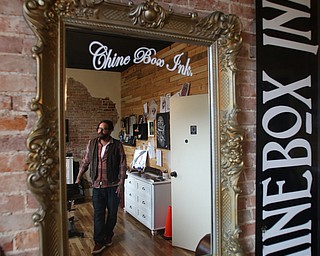 Reflection of Aaron Chine in his studio space, Thursday, August 24, 2017 at The Box Gallery in Warren...(Nikos Frazier | The Vindicator)
