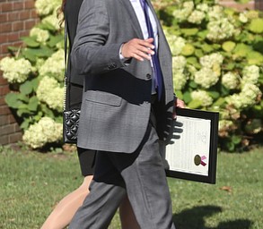 State Sen. Joe Schiavoni and wife, Margaret, walk into the church during former state Sen. Harry Meshel's funeral, Sept. 9, 2017, at St. Nicholas Greek Orthodox Church in Youngstown...(Nikos Frazier | The Vindicator)