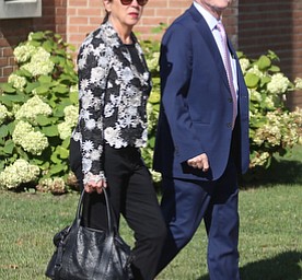 Former State Rep. Bob Hagan, and State Rep. Michele Lapore-Hagan walk into the church during former state Sen. Harry Meshel's funeral, Sept. 9, 2017, at St. Nicholas Greek Orthodox Church in Youngstown...(Nikos Frazier | The Vindicator)