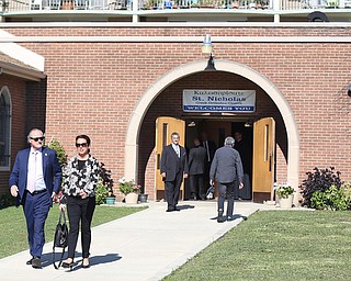 Former State Rep. Bob Hagan, and State Rep. Michele Lapore-Hagan exit the church during former state Sen. Harry Meshel's funeral, Sept. 9, 2017, at St. Nicholas Greek Orthodox Church in Youngstown...(Nikos Frazier | The Vindicator)