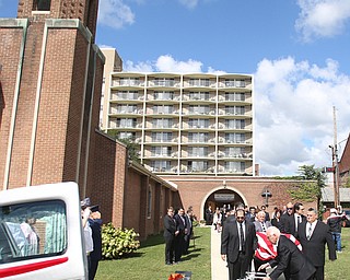 A veteran salutes as the casket bearing former state Sen. Harry Meshel's exits the church, Sept. 9, 2017, at St. Nicholas Greek Orthodox Church in Youngstown...(Nikos Frazier | The Vindicator)