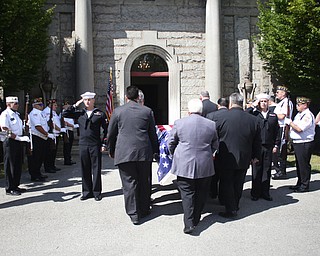 Honor guard members salue as the casket bearing former state Sen. Harry Meshel's arrives at the cemetery, Sept. 9, 2017, at Belmont Park Cemetery in Youngstown...(Nikos Frazier | The Vindicator)