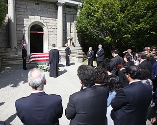 Fr. Joesph DiStefano prays during former state Sen. Harry Meshel's funeral, Sept. 9, 2017, at Belmont Park Cemetery in Youngstown...(Nikos Frazier | The Vindicator)