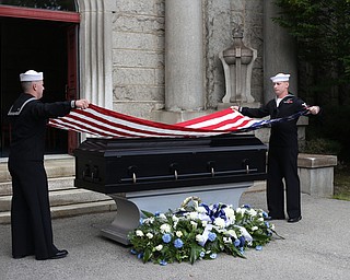HM2 Todd Bollinger and GM3 Joshua Kramer of NOSC Youngstown fold the flag during former state Sen. Harry Meshel's funeral, Sept. 9, 2017, at Belmont Park Cemetery in Youngstown...(Nikos Frazier | The Vindicator)