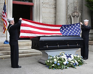HM2 Todd Bollinger and GM3 Joshua Kramer of NOSC Youngstown fold the flag during former state Sen. Harry Meshel's funeral, Sept. 9, 2017, at Belmont Park Cemetery in Youngstown...(Nikos Frazier | The Vindicator)