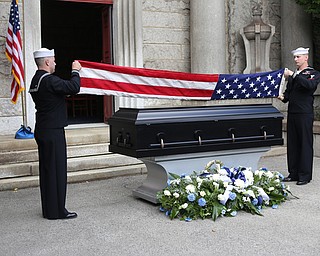 HM2 Todd Bollinger and GM3 Joshua Kramer of NOSC Youngstown fold the flag during former state Sen. Harry Meshel's funeral, Sept. 9, 2017, at Belmont Park Cemetery in Youngstown...(Nikos Frazier | The Vindicator)