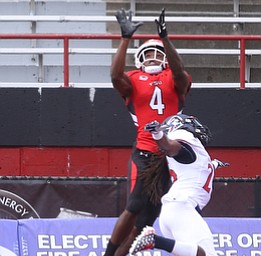 Youngstown State University wide receiver Damoun Patterson (4) jumps up for the catch as Robert Morris University defensive back Heavon Price (25) tries to take him down in the first quarter as Robert Morris University takes on Youngstown State University, Saturday, Sept. 9, 2017, at Stambaugh Stadium in Youngstown. The play was no good because of a defensive error. Youngstown State won 30-0...(Nikos Frazier | The Vindicator)..
