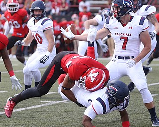 Robert Morris University wide receiver Andrew Romanchak (7) reaches out to catch Robert Morris University wide receiver Harrison Dreher (6)'s fumble after he was tackled by Youngstown State University linebacker qMalachi Newell (6)in the first quarter as Robert Morris University takes on Youngstown State University, Saturday, Sept. 9, 2017, at Stambaugh Stadium in Youngstown. Youngstown State won 30-0...(Nikos Frazier | The Vindicator)..