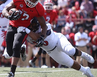 Youngstown State University tail back Tevin McCaster (37) is tackled by Robert Morris University linebacker Joseph Uhatafe (10) in the first quarter as Robert Morris University takes on Youngstown State University, Saturday, Sept. 9, 2017, at Stambaugh Stadium in Youngstown. Youngstown State won 30-0...(Nikos Frazier | The Vindicator)..