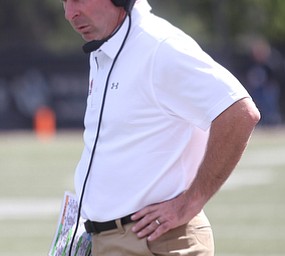 Youngstown State University head coach Bo Pelini looks down in the second quarter as Robert Morris University takes on Youngstown State University, Saturday, Sept. 9, 2017, at Stambaugh Stadium in Youngstown. Youngstown State won 30-0...(Nikos Frazier | The Vindicator)..
