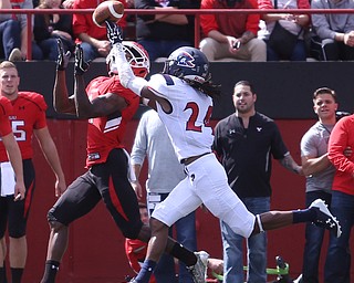 Youngstown State University wide receiver Damoun Patterson (4) opens up for the catch as he is pursued by Robert Morris University defensive back Tevaul Brown (24) in the second quarter as Robert Morris University takes on Youngstown State University, Saturday, Sept. 9, 2017, at Stambaugh Stadium in Youngstown. Youngstown State won 30-0...(Nikos Frazier | The Vindicator)..