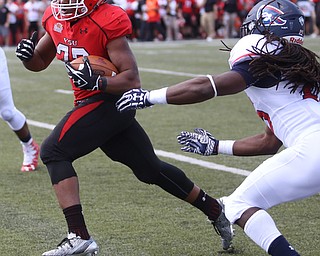 Youngstown State University tail back Tevin McCaster (37) dodges Robert Morris University defensive back Heavon Price (25) in the third quarter as Robert Morris University takes on Youngstown State University, Saturday, Sept. 9, 2017, at Stambaugh Stadium in Youngstown. Youngstown State won 30-0...(Nikos Frazier | The Vindicator)..