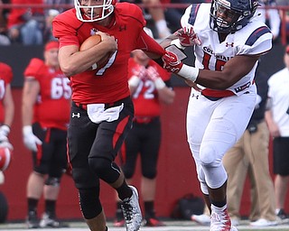 Youngstown State University quarterback Nathan Mays (7) pushes off Robert Morris University defensive lineman Derian Smith (15) in the third quarter as Robert Morris University takes on Youngstown State University, Saturday, Sept. 9, 2017, at Stambaugh Stadium in Youngstown. Youngstown State won 30-0...(Nikos Frazier | The Vindicator)..