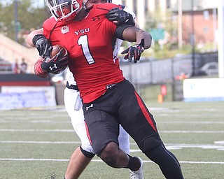 Youngstown State University wide receiver Isiah Scott (1)is taken down by Robert Morris University linebacker Adam Wollet (33) in the third quarter as Robert Morris University takes on Youngstown State University, Saturday, Sept. 9, 2017, at Stambaugh Stadium in Youngstown. Youngstown State won 30-0...(Nikos Frazier | The Vindicator)..