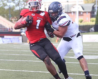 Youngstown State University wide receiver Isiah Scott (1)is taken down by Robert Morris University linebacker Adam Wollet (33) in the third quarter as Robert Morris University takes on Youngstown State University, Saturday, Sept. 9, 2017, at Stambaugh Stadium in Youngstown. Youngstown State won 30-0...(Nikos Frazier | The Vindicator)..