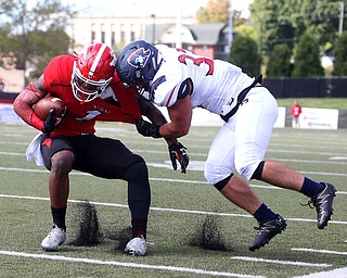 Youngstown State University wide receiver Isiah Scott (1)is taken down by Robert Morris University linebacker Adam Wollet (33) in the third quarter as Robert Morris University takes on Youngstown State University, Saturday, Sept. 9, 2017, at Stambaugh Stadium in Youngstown. Youngstown State won 30-0...(Nikos Frazier | The Vindicator)..