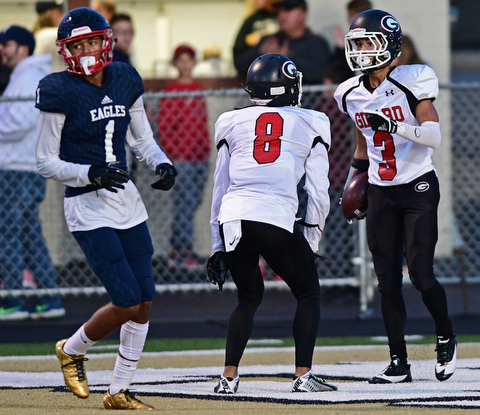 WARREN, OHIO - SEPTEMBER 9, 2017: Girard's Devin Wilson, right, celebrates with Anthony Backus after scoring a touchdown during the first half of their game Saturday night at Warren Harding High School. DAVID DERMER | THE VINDICATOR..JFK's Hyland Burton pictured.
