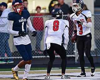 WARREN, OHIO - SEPTEMBER 9, 2017: Girard's Devin Wilson, right, celebrates with Anthony Backus after scoring a touchdown during the first half of their game Saturday night at Warren Harding High School. DAVID DERMER | THE VINDICATOR..JFK's Hyland Burton pictured.