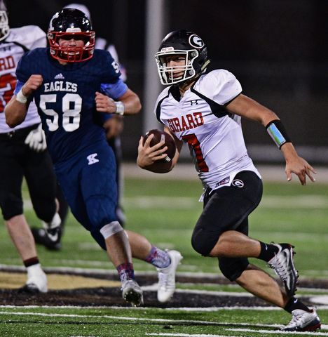 WARREN, OHIO - SEPTEMBER 9, 2017: Girard's Mark Said runs the ball during the second half of their game Saturday night at Warren Harding High School. DAVID DERMER | THE VINDICATOR..JFK's Chris Urchek pictured.
