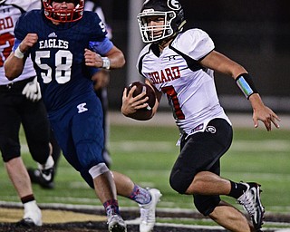 WARREN, OHIO - SEPTEMBER 9, 2017: Girard's Mark Said runs the ball during the second half of their game Saturday night at Warren Harding High School. DAVID DERMER | THE VINDICATOR..JFK's Chris Urchek pictured.