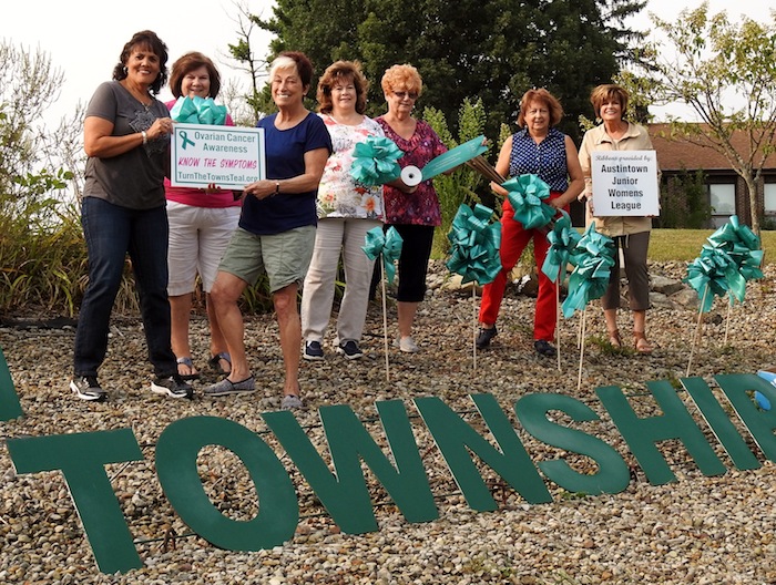 The Austintown Junior Women’s League recently erected signs and teal-colored bows at the entrance to Austintown Township Park to promote awareness of ovarian cancer. This event is part of the “Turn the Towns Teal” national campaign, in partnership with the Rose Mary Flanagan Ovarian Cancer Foundation. Fliers and information were left at Stacey Pavilion with information about the early warning signs of ovarian cancer. Anyone in Northeast Ohio touched by this disease can call the foundation 330-518-2431. Information and photos about the AJWL can be found at www.facebook.com/AJWL2014. At right, AJWL members involved in the campaign include, from left, Ruty Rodriguez-Patterson, Peggy Bennett, Genevieve Bodnar, Marye Kay Erickson, Janie Surman, Sue Hovanec and Kathy Rusback.
