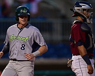 NILES, OHIO - SEPTEMBER 11, 2017: Vermont's Will Toffey, left, scores a run on a double by Logan Farrar in the third inning of Monday nights New York - Penn League playoff game at Eastwood Field. DAVID DERMER | THE VINDICATOR..Mahoning Valley catcher Gianpaul Gonzalez pictured.