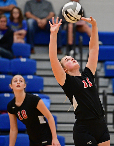HUBBARD, OHIO - SEPTEMBER 12, 2017: Canfield's Alyssa Householder, right, sets the ball up for Grace Mangapora during their match, Tuesday night at Hubbard High School. DAVID DERMER | THE VINDICATOR