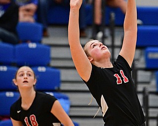 HUBBARD, OHIO - SEPTEMBER 12, 2017: Canfield's Alyssa Householder, right, sets the ball up for Grace Mangapora during their match, Tuesday night at Hubbard High School. DAVID DERMER | THE VINDICATOR