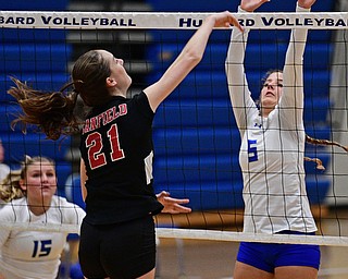 HUBBARD, OHIO - SEPTEMBER 12, 2017: Hubbard's Silvia Genoni, right, goes for the block of the shot from Canfield's Alexis Metille during their match, Tuesday night at Hubbard High School. DAVID DERMER | THE VINDICATOR