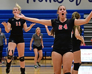 HUBBARD, OHIO - SEPTEMBER 12, 2017: Canfield's Marissa Yourstowsky, center, and Alyssa Householder react after a call from the referee that awarded Hubbard a point during their match, Tuesday night at Hubbard High School. DAVID DERMER | THE VINDICATOR..Referee award Hubbard point after four Canfield hits, Canfield players and coaches protested they only hit it three times.