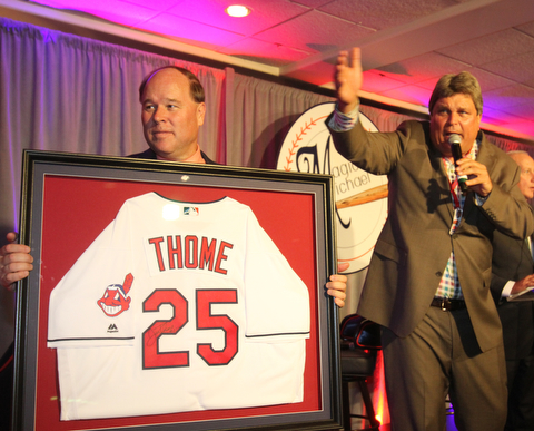 William D Lewis The vindicator  Ed Muransky auctions off a signed Jim Thome jersey being held by Dana Balash during Magic of Michael event 9-13-17 at Lake Club.