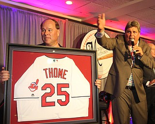 William D Lewis The vindicator  Ed Muransky auctions off a signed Jim Thome jersey being held by Dana Balash during Magic of Michael event 9-13-17 at Lake Club.