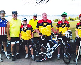 Above, members of the Out-Spokin’ Wheelmen, from left, are John Nagy, Greg Merritt, President Mary Merritt, Bob Murwin, Neil Betts, Kelley Walker and Treasurer Lynn Baker. The group will  sponsor an invitational ride Sunday.
