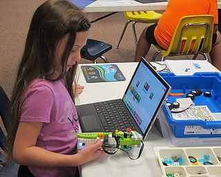 Neighbors | Zack Shively .A child worked on her robot at Lego WeDo Robots on Aug. 7 at the main library.