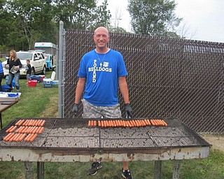 Neighbors | Zack Shively  .Poland Dobbins Elementary PTO members helped run a tailgate before the second Poland Seminary High School football game. Some members handed out water, cooked hotdogs and ran tables during the event.