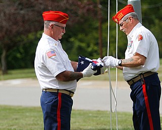    ROBERT K. YOSAY  | THE VINDICATOR..Post 472 and Neil Kennedy Recovery Centers joined forces to paint the flag pole and raise a new flag - with the date 9/11 - as a background Jeff Gulling and Gene Apgar with  Tri-State Marine Corps League #494  officially raised the new flag ...-30-