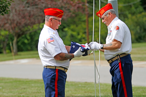     ROBERT K. YOSAY  | THE VINDICATOR..Post 472 and Neil Kennedy Recovery Centers joined forces to paint the flag pole and raise a new flag - with the date 9/11 - as a background Jeff Gulling and Gene Apgar with  Tri-State Marine Corps League #494  officially raised the new flag ...-30-