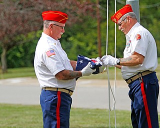    ROBERT K. YOSAY  | THE VINDICATOR..Post 472 and Neil Kennedy Recovery Centers joined forces to paint the flag pole and raise a new flag - with the date 9/11 - as a background Jeff Gulling and Gene Apgar with  Tri-State Marine Corps League #494  officially raised the new flag ...-30-