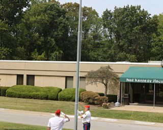     ROBERT K. YOSAY  | THE VINDICATOR..Post 472 and Neil Kennedy Recovery Centers joined forces to paint the flag pole and raise a new flag - with the date 9/11 - as a background Jeff Gulling and Gene Apgar with  Tri-State Marine Corps League #494  officially raised the new flag ...-30-