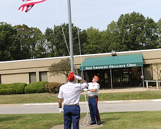     ROBERT K. YOSAY  | THE VINDICATOR..Post 472 and Neil Kennedy Recovery Centers joined forces to paint the flag pole and raise a new flag - with the date 9/11 - as a background Jeff Gulling and Gene Apgar with  Tri-State Marine Corps League #494  officially raised the new flag ...-30-