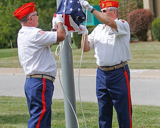     ROBERT K. YOSAY  | THE VINDICATOR..Post 472 and Neil Kennedy Recovery Centers joined forces to paint the flag pole and raise a new flag - with the date 9/11 - as a background Jeff Gulling and Gene Apgar with  Tri-State Marine Corps League #494  officially raised the new flag ...-30-