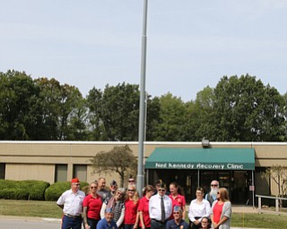     ROBERT K. YOSAY  | THE VINDICATOR..Post 472 and Neil Kennedy Recovery Centers joined forces to paint the flag pole and raise a new flag - with the date 9/11 - as a background Jeff Gulling and Gene Apgar with  Tri-State Marine Corps League #494  officially raised the new flag ...-30-