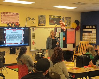 Neighbors | Zack Shively  .Educator Kristin Havich talked with parents at Austintown Elementary School's open house on Sept. 6. The event provided a chance for parents to learn the classroom their child will be learning in over the next school year.