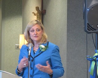 Neighbors | Zack Shively  .Genie Aubel, president of St. Elizabeth Boardman Hospital, welcomed the community to the opening ceremony for the new Sr. Margaret Mary Siegfried H.M. Ambulatory Pharmacy on Sep. 8.