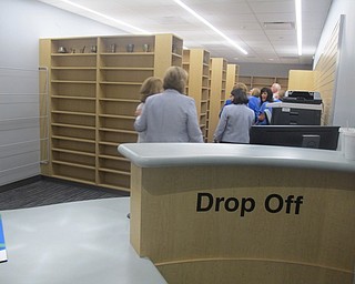 Neighbors | Zack Shively  .Those at the ribbon cutting event on Sep. 8 toured the new ambulatory pharmacy. The facility plans to open in October and will begin a "Meds to Beds" program that allows patients to receive their medications themselves prior to leaving the hospital. The community will also be able to receive their medications at the pharmacy as well.