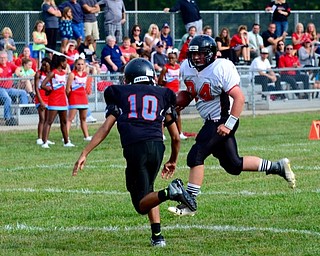 Neighbors | Submitted.Canfield Village Middle School seventh grade tight end AJ Havrilla is pictured rumbling for yardage against Alliance at the recent game. Canfield victorious over Alliance 24-8.